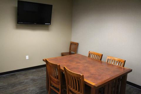 Large study room with 6 chairs. 