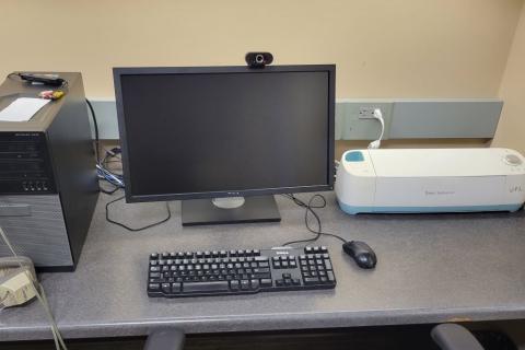 Computer station with cricut machine. 