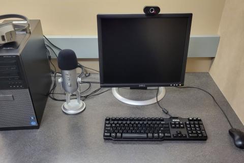 Computer station with microphone.