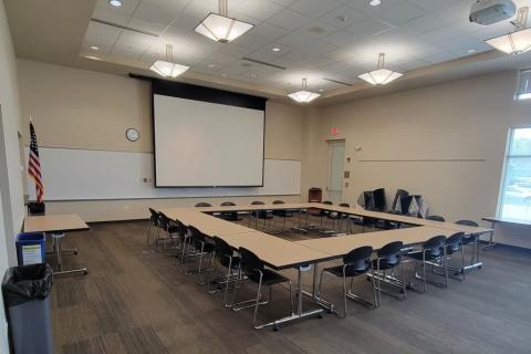 Ten tables in an open square with 20 chairs.