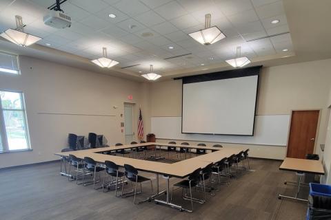 Ten tables in an open square with 20 chairs.