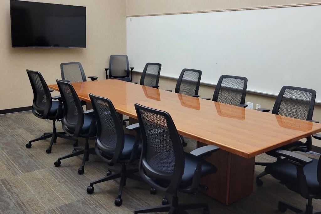 Conference table with 10 chairs. 